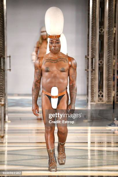 Model walks the runway at the Pam Hogg Show during London Fashion Week September 2018 at XXXX on September 14, 2018 in London, England.