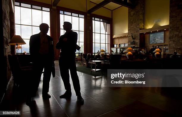 Charles Plosser, president of the Federal Reserve Bank of Philadelphia, left, talk to Raghuram Rajan, professor of finance at the University of...