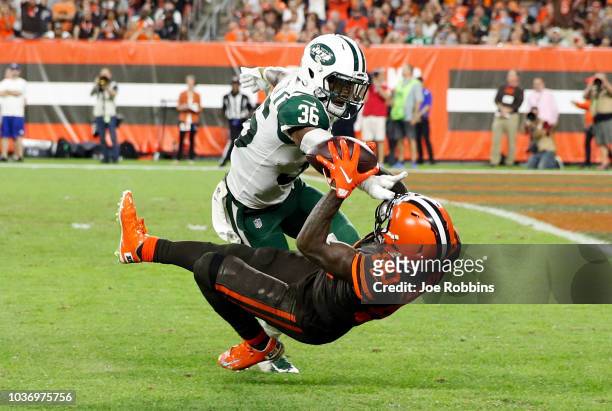 Jarvis Landry of the Cleveland Browns makes a catch in front of Doug Middleton of the New York Jets during the third quarter at FirstEnergy Stadium...
