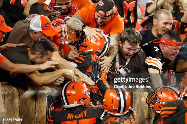 Terrance Mitchell of the Cleveland Browns celebrates his interception with fans during the fourth quarter against the New York Jets at FirstEnergy...