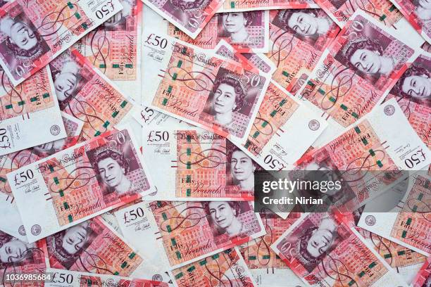 background of british fifty pound banknotes - 50 pound notes stock pictures, royalty-free photos & images