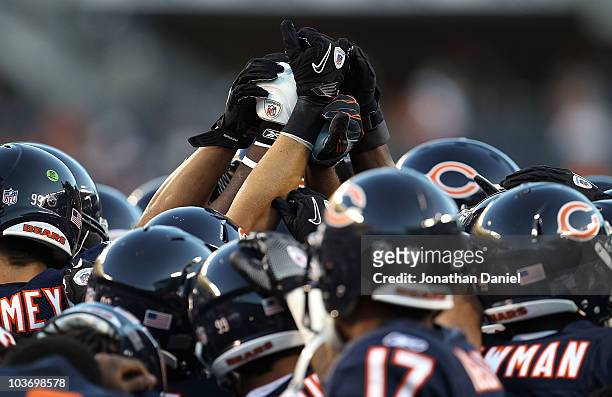 Members of the Chicago Bears prepare for a game against the Arizona Cardinals during a preseason game at Soldier Field on August 28, 2010 in Chicago,...