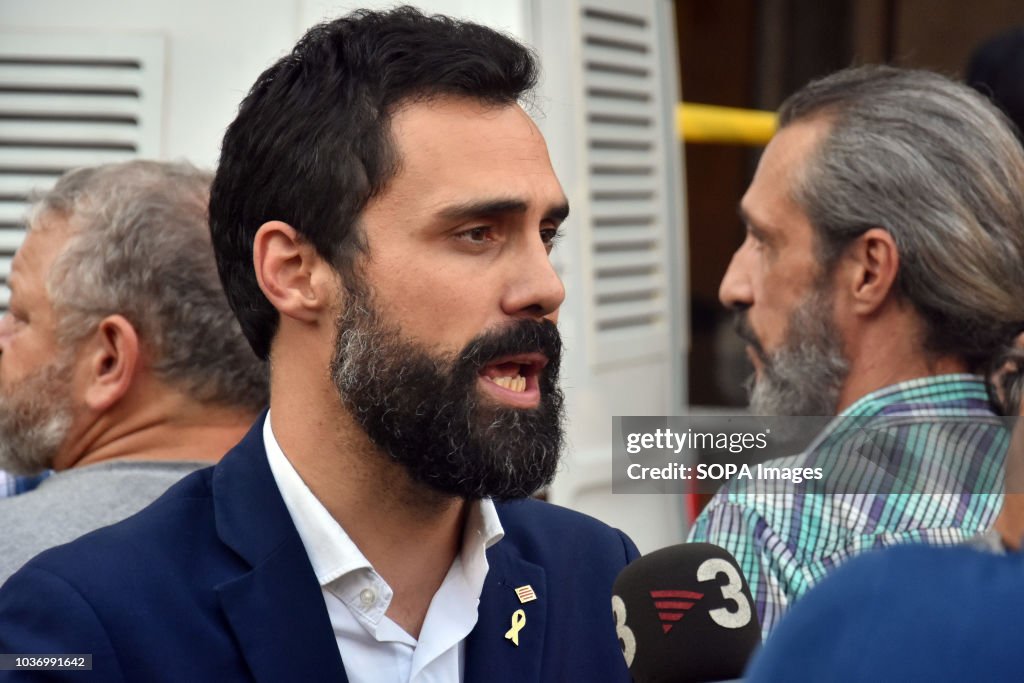 A Member of parliament seen speaking to the media during...