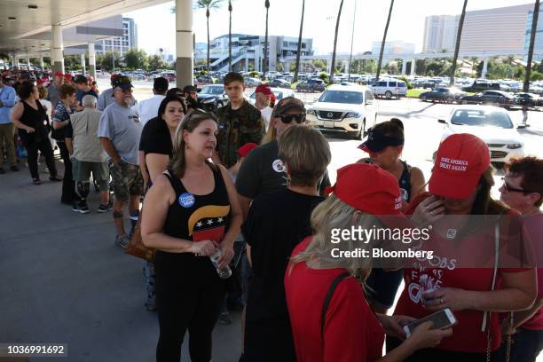 Attendees wait to join a rally with U.S. President Donald Trump at the Las Vegas Convention Center in Las Vegas, Nevada, U.S., on Thursday, Sept. 20,...