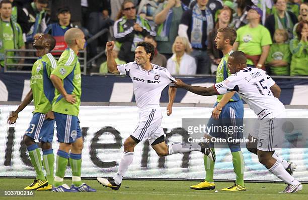 John Thorrington of the Chicago Fire is congratulated by Collins John after scoring in the first half against the Seattle Sounders FC on August 28,...