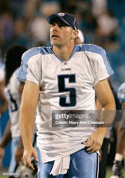 Quarterback Kerry Collins of the Tennessee Titans looks up at the stands as he leaves the stadium after their preseason game against the Carolina...