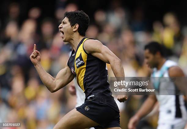 Robin Nahas of the Tigers gestures after kicking a goal during the round 22 AFL match between the Richmond Tigers and the Port Power at Etihad...