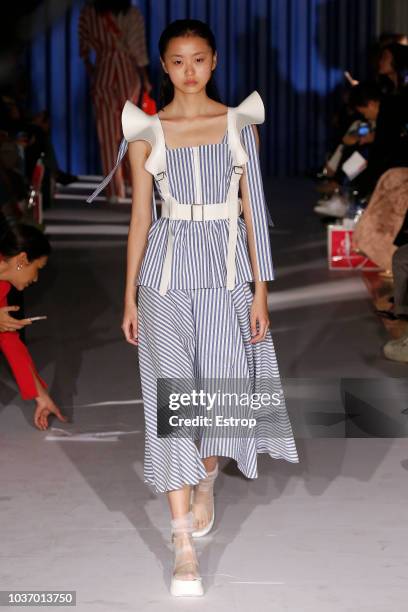 Model walks the runway at the Xiao Li Show during London Fashion Week September 2018 at The BFC Show Space on September 14, 2018 in London, England.