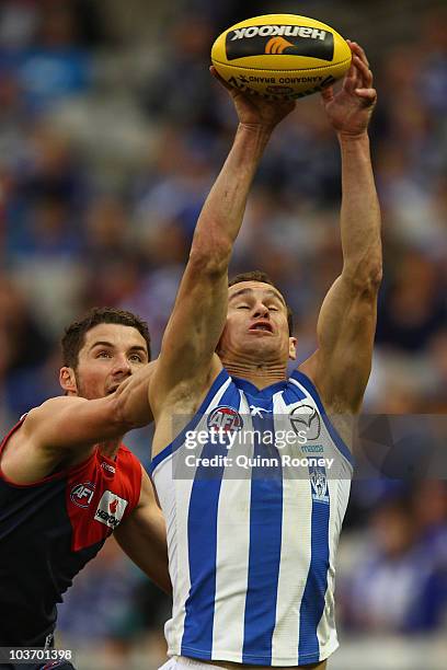 Corey Jones of the Kangaroos marks during the round 22 AFL match between the Melbourne Demons and the North Melbourne Kangaroos at Melbourne Cricket...