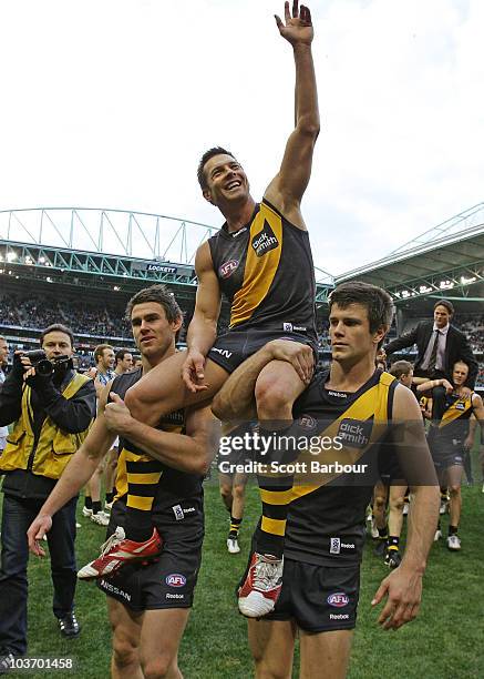 Ben Cousins of the Tigers is lifted on his team mates shoulders as he leaves the ground after the round 22 AFL match between the Richmond Tigers and...