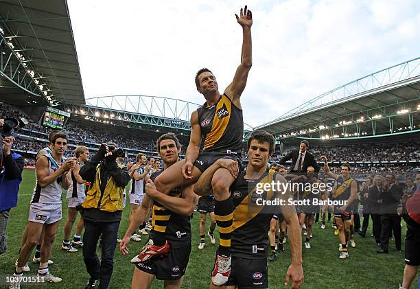 Ben Cousins of the Tigers is lifted on his team mates shoulders as he leaves the ground after the round 22 AFL match between the Richmond Tigers and...