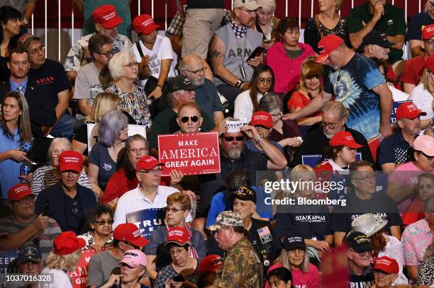 An attendee holds a placard reading "Make America Great Again" during a rally with U.S. President Donald Trump in Las Vegas, Nevada, U.S., on...