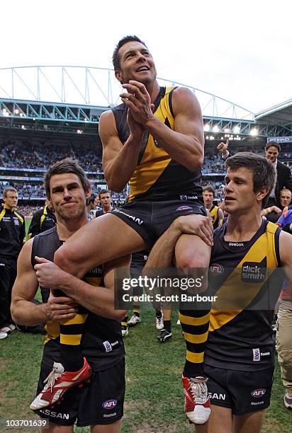 Ben Cousins of the Tigers is lifted on his team mates shoulders as he leaves the ground after the round 22 AFL match between the Richmond Tigers and...