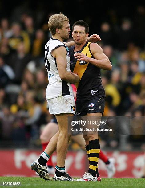 Ben Cousins of the Tigers is embraced after the round 22 AFL match between the Richmond Tigers and the Port Power at Etihad Stadium on August 29,...