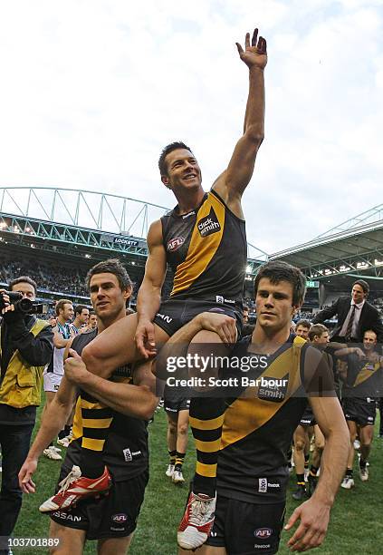 Ben Cousins of the Tigers is lifted on his team mates shoulders as he leaves the ground after the round 22 AFL match between the Richmond Tigers and...