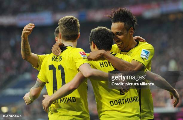 Dortmund's Marco Reus , goal scorer Jonas Hofmann and Pierre-Emerick Aubameyang celebrate the 0-3 during the Bundesliga soccer match between FC...