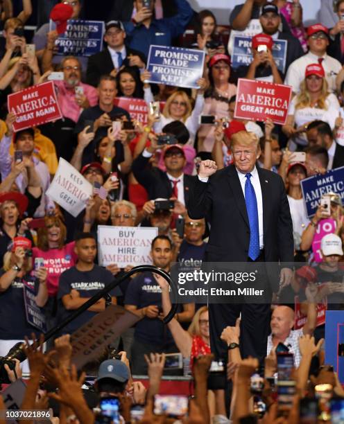 President Donald Trump gestures as he walks onstage for a campaign rally at the Las Vegas Convention Center on September 20, 2018 in Las Vegas,...