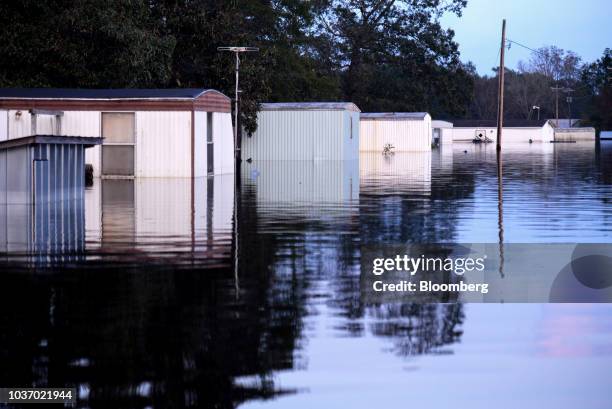 Houses stand submerged by floodwaters after Hurricane Florence hit in Bergaw, North Carolina, U.S., on Thursday, Sept. 20, 2018. President Donald...