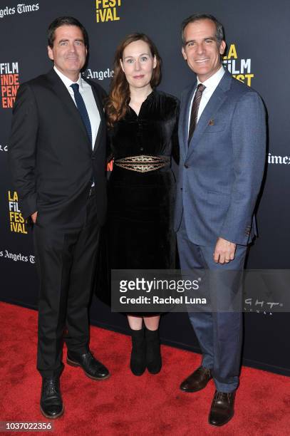 Josh Welsh, Jennifer Cochis and LA Mayor Eric Garcetti arrive at the 2018 LA Film Festival opening night premiere of "Echo In The Canyon" at John...