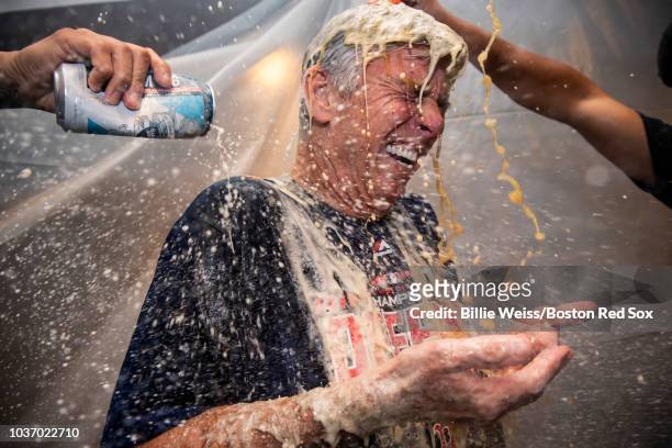 President of Baseball Operations Dave Dombrowski of the Boston Red Sox celebrates in the clubhouse after clinching the American League East division...