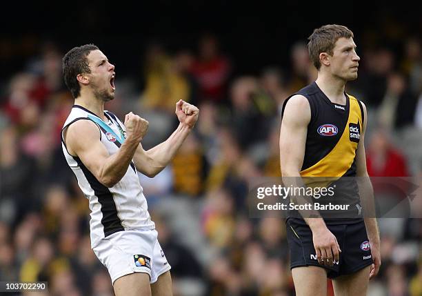 Travis Boak of the Power celebrates after kicking a goal during the round 22 AFL match between the Richmond Tigers and the Port Power at Etihad...