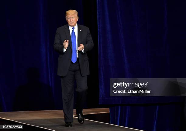 President Donald Trump walks onstage for a campaign rally at the Las Vegas Convention Center on September 20, 2018 in Las Vegas, Nevada. Trump is in...