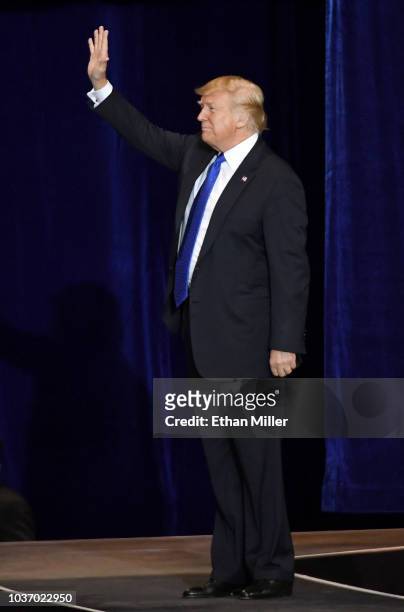President Donald Trump waves as he walks onstage for a campaign rally at the Las Vegas Convention Center on September 20, 2018 in Las Vegas, Nevada....