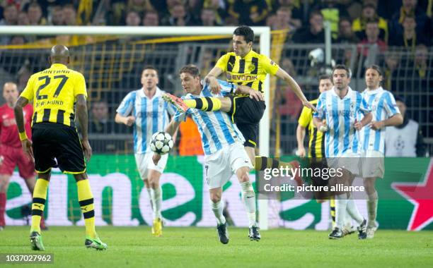 Dortmund's Nuri Sahin and Malaga's Joaquin vie for the ball during the UEFA Champions League quarter final second leg soccer match between Borussia...