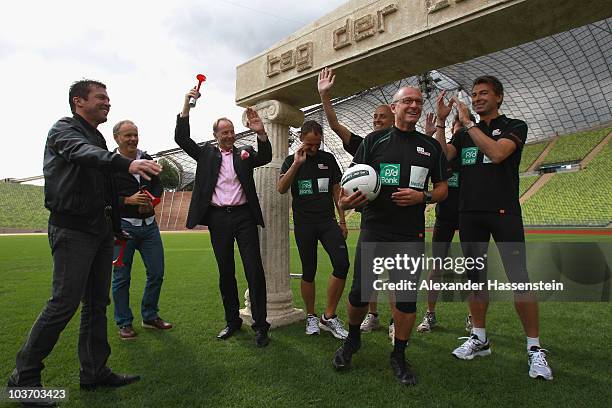 Lothar Matthaeus celebrates with TV presenter Reinhold Beckmann the launch of the Day of Legends at the Olympic Stadium on August 29, 2010 in Munich,...