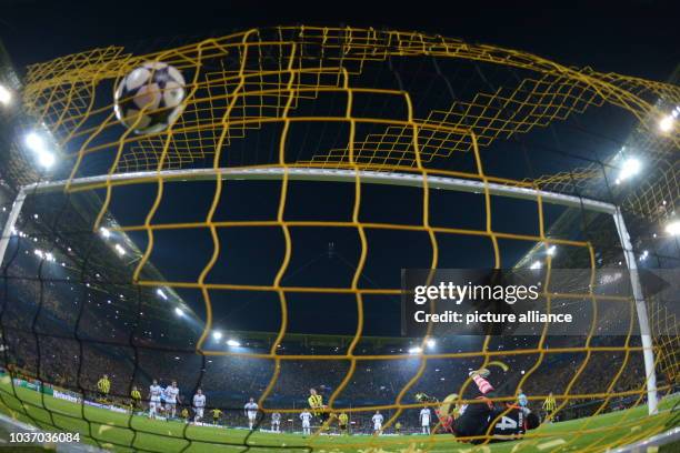 Dortmund's Robert Lewandowski scores the goal 4-1 by penalty against Madrid's goalkeeper Diego Lopez during the UEFA Champions League semi final...