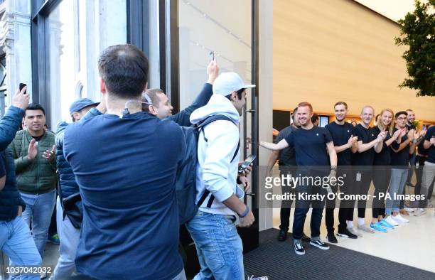 The first customers enter the Apple Store in Regent Street, central London, as the iPhone XS and XS Max go on sale in the UK for the first time,...
