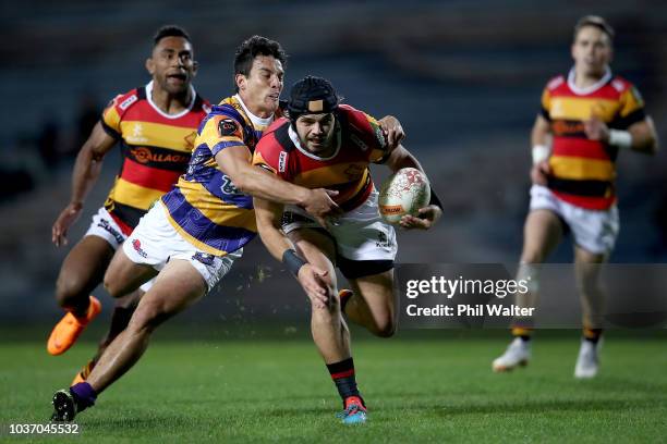 Mathew Landsdown of Waikato is tackled during the round six Mitre 10 Cup match between Bay of Plenty and Waikato at Rotorua International Stadium on...