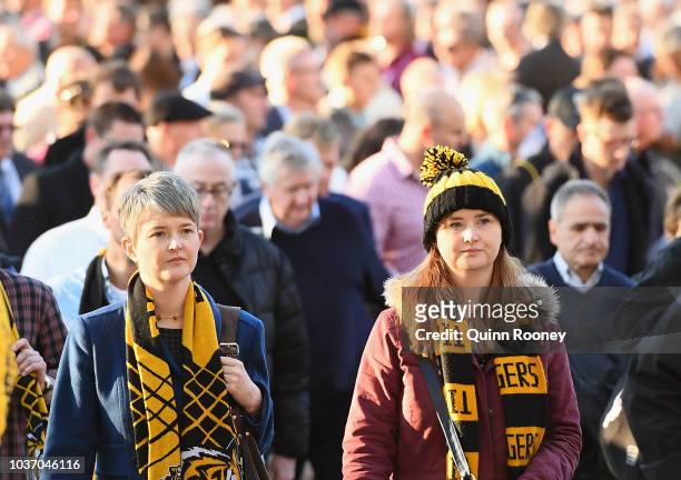 Fans walk to the MCG on September 21, 2018 in Melbourne, Australia. Over 100,000 fans are expected in Melbourne's sporting precinct as the city plays...