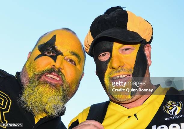 Tiger fans pose outside the MCG on September 21, 2018 in Melbourne, Australia. Over 100,000 fans are expected in Melbourne's sporting precinct as the...
