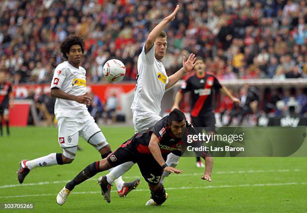 Thorben Marx of Moenchengladbach challenges Arturo Vodal of Leverkusen during the Bundesliga match between Bayer Leverkusen and Borussia...