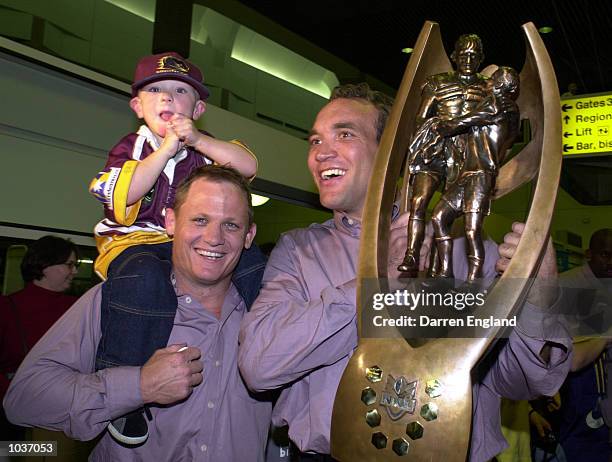 Kevin Walters and Gorden Tallis of the Brisbane Broncos celebrate winning the N.R.L Grand Final against the Sydney Roosters with Broncos fans at...