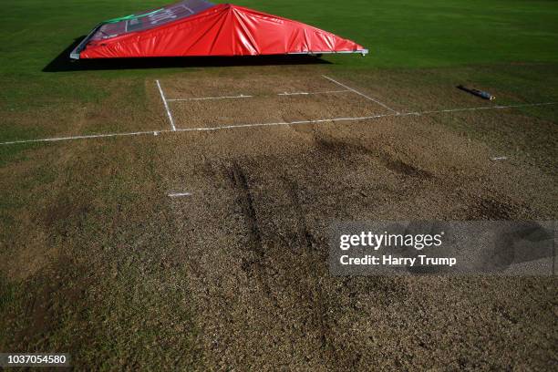 Detailed view of the wicket as strong winds and heavy rain force a section of the covers to blow off and damage the pitch resulting in an abandonment...