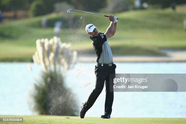 Paul Waring of England takes his second shot on hole eleven during Day Two of the Portugal Masters at Dom Pedro Victoria Golf Course on September 21,...