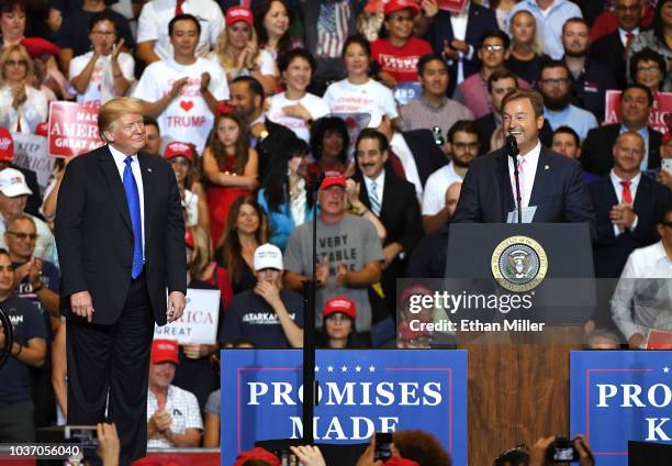 President Donald Trump looks on as U.S. Sen. Dean Heller speaks during a campaign rally at the Las Vegas Convention Center on September 20, 2018 in...