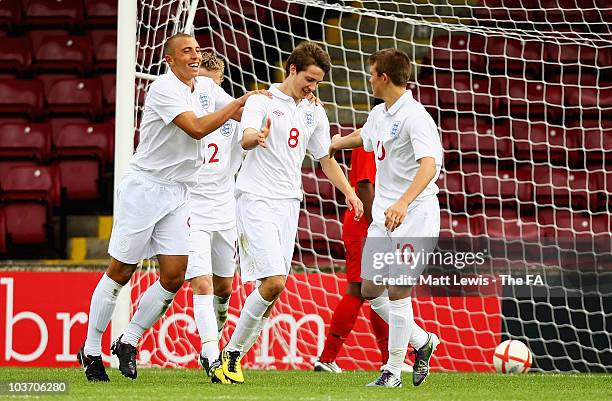 Nick Powell of England is congratulated on his goal during the FA International U17 Tournament match between England and Portugal at Glanford Park on...