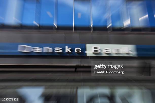 The logo of Danske Bank A/S sits on display in this motion blur effect photo outside a bank branch in Copenhagen, Denmark, on Wednesday, Sept. 19,...