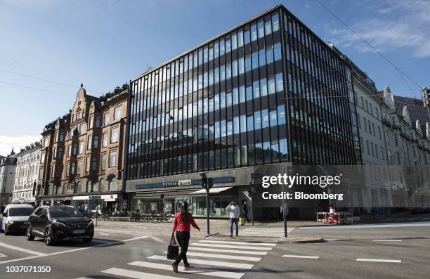 Pedestrians use a road crossing outside a Danske Bank A/S bank branch in central Copenhagen, Denmark, on Wednesday, Sept. 19, 2018. Danske Bank...