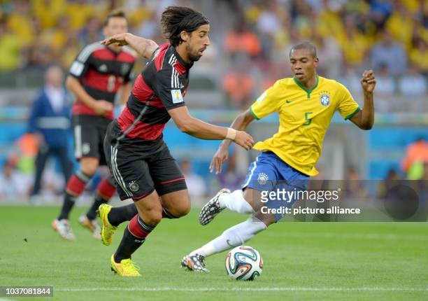 Germany's Sami Khedira and Brazil's Fernandinho vie for the ball during the FIFA World Cup 2014 semi-final soccer match between Brazil and Germany at...