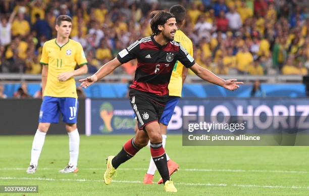 Germany's Sami Khedira celebrates after scoring the 0-5 goal during the FIFA World Cup 2014 semi-final soccer match between Brazil and Germany at...