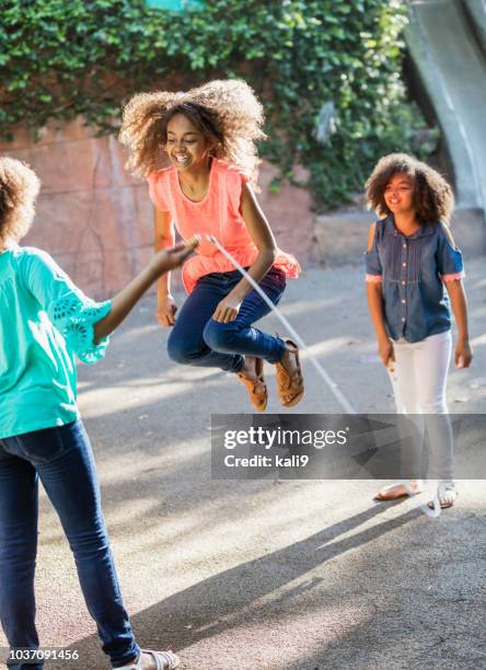african-american sisters jumping rope - skipping rope stock pictures, royalty-free photos & images