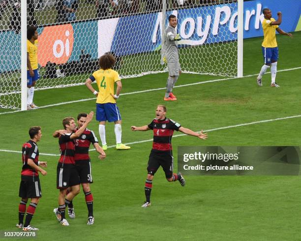 Germany's Thomas Mueller celebrates after scoring the 0-1 goal during the FIFA World Cup 2014 semi-final soccer match between Brazil and Germany at...