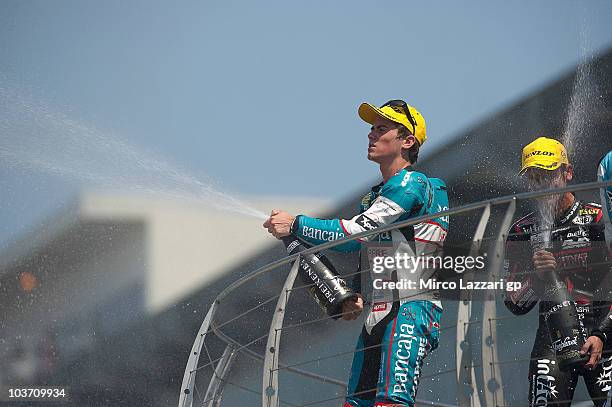 Nico Terol of Spain and Bancaja Aspar Team celebrates the victory and sprays champagne on the podium at the end of 125 cc race of the Red Bull...