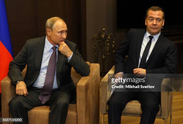 Russian President Vladimir Putin look on Prime Minister Dmitry Medvedev during Russian-Belarussian meeting at Putin's Black Sea state residence of...