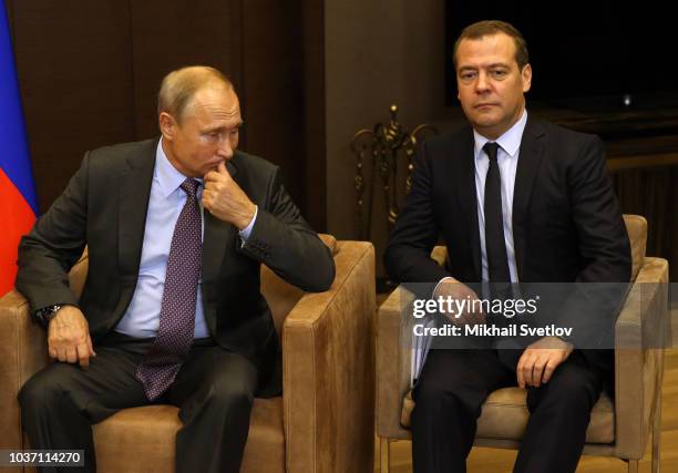 Russian President Vladimir Putin looks on Prime Minister Dmitry Medvedev during Russian-Belarussian meeting at Putin's Black Sea state residence of...