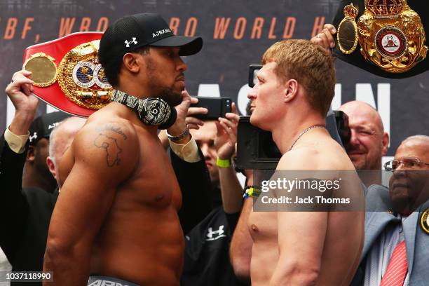 Anthony Joshua And Alexander Povetkin face off after the Anthony Joshua And Alexander Povetkin weigh in on September 21, 2018 in London, England.